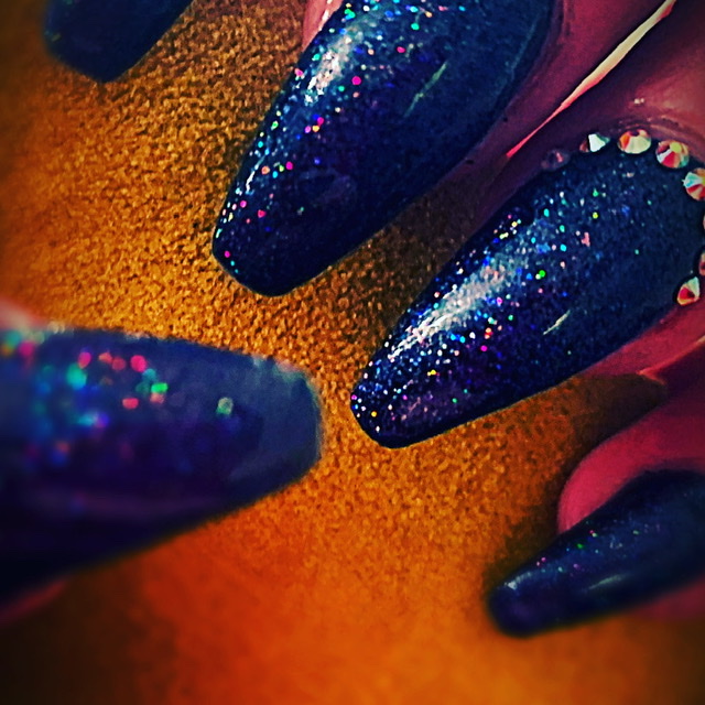 Deep blue glitter nails with sparkling details
